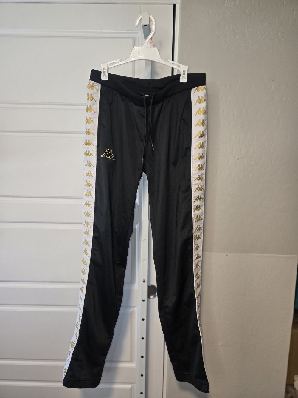 Kappa Black Track Pants with Gold Logo and White Side Tape